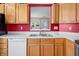 The Kitchen features white countertops, wood cabinets, stainless steel range, and double stainless steel sink at 1127 Alydar Cir, Indianapolis, IN 46217