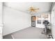 Enclosed patio with white vinyl siding, carpet flooring, ceiling fan, and open windows at 1127 Alydar Cir, Indianapolis, IN 46217