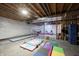 Unfinished basement with play area and gymnastics equipment at 11592 Saltford Ln, Fishers, IN 46037