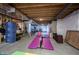 Unfinished basement with fitness area and storage at 11592 Saltford Ln, Fishers, IN 46037