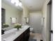 Bathroom featuring double sinks, a large mirror, and a shower-tub combo with a white shower curtain at 11592 Saltford Ln, Fishers, IN 46037