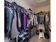Walk-in closet featuring clothing racks, a shelf with shoes, and organized storage at 11592 Saltford Ln, Fishers, IN 46037