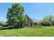 Stone clubhouse with covered area, nestled within a well-maintained green community space at 11592 Saltford Ln, Fishers, IN 46037