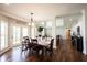 Cozy dining room with natural light, hardwood floors, and an inviting atmosphere for Gathering meals at 11592 Saltford Ln, Fishers, IN 46037