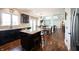 Spacious kitchen featuring granite counters, stainless steel appliances, and seamless flow to the dining area at 11592 Saltford Ln, Fishers, IN 46037