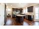 Modern kitchen with granite countertops, stainless steel appliances, and a breakfast bar, perfect for cooking at 11592 Saltford Ln, Fishers, IN 46037
