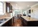 Open-concept kitchen featuring granite counters, stainless steel appliances, and seamless flow to the dining area at 11592 Saltford Ln, Fishers, IN 46037