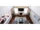 Bright living room features a fireplace, hardwood floors, and a vaulted ceiling at 11592 Saltford Ln, Fishers, IN 46037