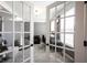 Office space with grey walls, two seating areas, and ample natural light from the windows at 11592 Saltford Ln, Fishers, IN 46037