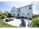 Expansive patio area with a brick firepit, seating, and outdoor dining at 11592 Saltford Ln, Fishers, IN 46037