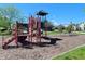 Community playground with colorful equipment and a safe, wood-chip surface at 11592 Saltford Ln, Fishers, IN 46037