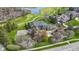 Stunning estate situated on a lush green lot with golf course views, featuring a basketball court and mature landscaping at 12010 Landover Ln, Fishers, IN 46037