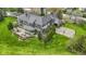 Beautiful estate home with a private patio, pergola, basketball court, and meticulously landscaped yard at 12010 Landover Ln, Fishers, IN 46037