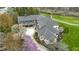 Aerial view of an expansive estate, featuring a large home with mature trees and beautiful landscaping at 12010 Landover Ln, Fishers, IN 46037