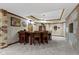 Finished basement bar area with wood paneled bar, stools and decorative stone column at 12010 Landover Ln, Fishers, IN 46037