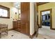 Bathroom with wood cabinets and drawers and access to the walk-in closet at 12010 Landover Ln, Fishers, IN 46037