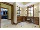 This bathroom features a vanity area and a walk-in closet with built-in shelving at 12010 Landover Ln, Fishers, IN 46037