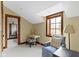 This bedroom features a seating area with a plush chair and desk nook at 12010 Landover Ln, Fishers, IN 46037