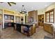 Open-concept kitchen features large island, granite countertops, and high-end appliances at 12010 Landover Ln, Fishers, IN 46037