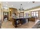 Spacious kitchen with island, custom cabinets, brick oven, and stainless steel appliances at 12010 Landover Ln, Fishers, IN 46037