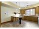 Spacious kitchen featuring ample countertop space, wooden cabinetry, and natural lighting at 12010 Landover Ln, Fishers, IN 46037