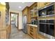 Gourmet kitchen features stainless steel appliances, custom cabinetry, and tile backsplash at 12010 Landover Ln, Fishers, IN 46037