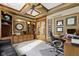 Well-appointed home office features custom built-ins, a tray ceiling, and lots of natural light at 12010 Landover Ln, Fishers, IN 46037