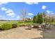 Outdoor patio area with fire pit, seating, and picturesque golf course views at 12010 Landover Ln, Fishers, IN 46037