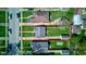 Aerial view highlighting the property's spacious backyard, detached garage, and tree-lined street at 1209 N Downey Ave, Indianapolis, IN 46219