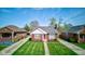An aerial view of a well maintained home with mature trees, and a lush green lawn in a residential neighborhood at 1209 N Downey Ave, Indianapolis, IN 46219