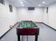 Finished basement featuring a foosball table and a dart board for entertainment at 1209 N Downey Ave, Indianapolis, IN 46219