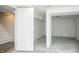 Unfinished basement space with concrete floors and open layout, offering potential for customization at 1209 N Downey Ave, Indianapolis, IN 46219