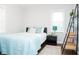 This bedroom offers a calming atmosphere with a coordinated color scheme and comfortable furnishings at 1209 N Downey Ave, Indianapolis, IN 46219