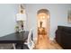 Bright home office with modern desk, chair, and hardwood floors flowing into the dining area at 1209 N Downey Ave, Indianapolis, IN 46219