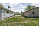 The backyard of a home with a detached garage and grassy area, ideal for outdoor activities at 1212 N 10Th St, Elwood, IN 46036