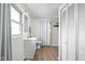 Bathroom featuring white fixtures, vanity sink, toilet, and a bright, airy feel at 1212 N 10Th St, Elwood, IN 46036