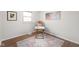 Cozy corner with a chair and table setup, showcasing artwork and natural light at 1212 N 10Th St, Elwood, IN 46036