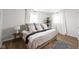 Bright bedroom featuring hardwood floors, neutral walls, and stylish decor at 1212 N 10Th St, Elwood, IN 46036