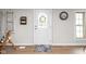 Inviting entryway with stylish decor, hardwood flooring, and natural light at 1212 N 10Th St, Elwood, IN 46036