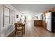 Open-concept kitchen and dining area with modern appliances, wood cabinets, and attractive flooring at 1212 N 10Th St, Elwood, IN 46036