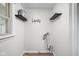 Laundry room with shelves and a utility sink, offering a functional space at 1212 N 10Th St, Elwood, IN 46036