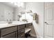 Chic bathroom with a marble countertop vanity, dark wood cabinets, and decorative accents at 12210 Doncaster Ct, Fishers, IN 46037