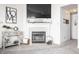 Close-up of a stylish fireplace with decorative accents and a mounted television above the mantel at 12210 Doncaster Ct, Fishers, IN 46037