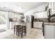 Well-lit kitchen featuring an island, modern appliances, and a breakfast bar at 12210 Doncaster Ct, Fishers, IN 46037