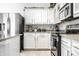 Contemporary kitchen featuring stainless steel appliances, granite counters, and ample storage at 12210 Doncaster Ct, Fishers, IN 46037