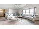 Spacious living room with ample seating, neutral décor, and an open layout for entertaining guests at 12210 Doncaster Ct, Fishers, IN 46037