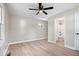 Bedroom features wood-look floors and a bathroom at 1243 N Post Rd, Indianapolis, IN 46219