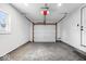 Spacious garage with a large door and ample room for parking and storage at 1243 N Post Rd, Indianapolis, IN 46219