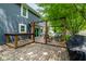 Backyard featuring a deck, grill, bar top, brick patio, pergola with furniture, and mature trees at 12577 Pointer Pl, Fishers, IN 46038