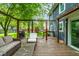 Backyard features a pergola with patio seating, BBQ grill, mature trees, and lush green lawn at 12577 Pointer Pl, Fishers, IN 46038